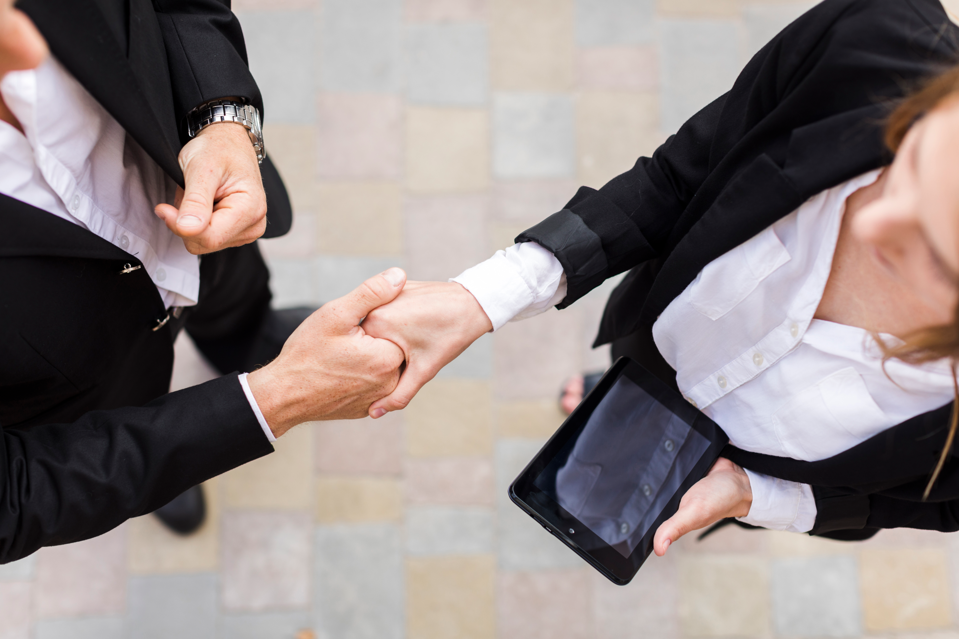 A handshake between a business owner and a lender, symbolizing access to capital through an alternative lending platform.